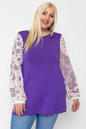 Floral Print, Contrasting Bubble Sleeves Tunic With A Round Neckline.